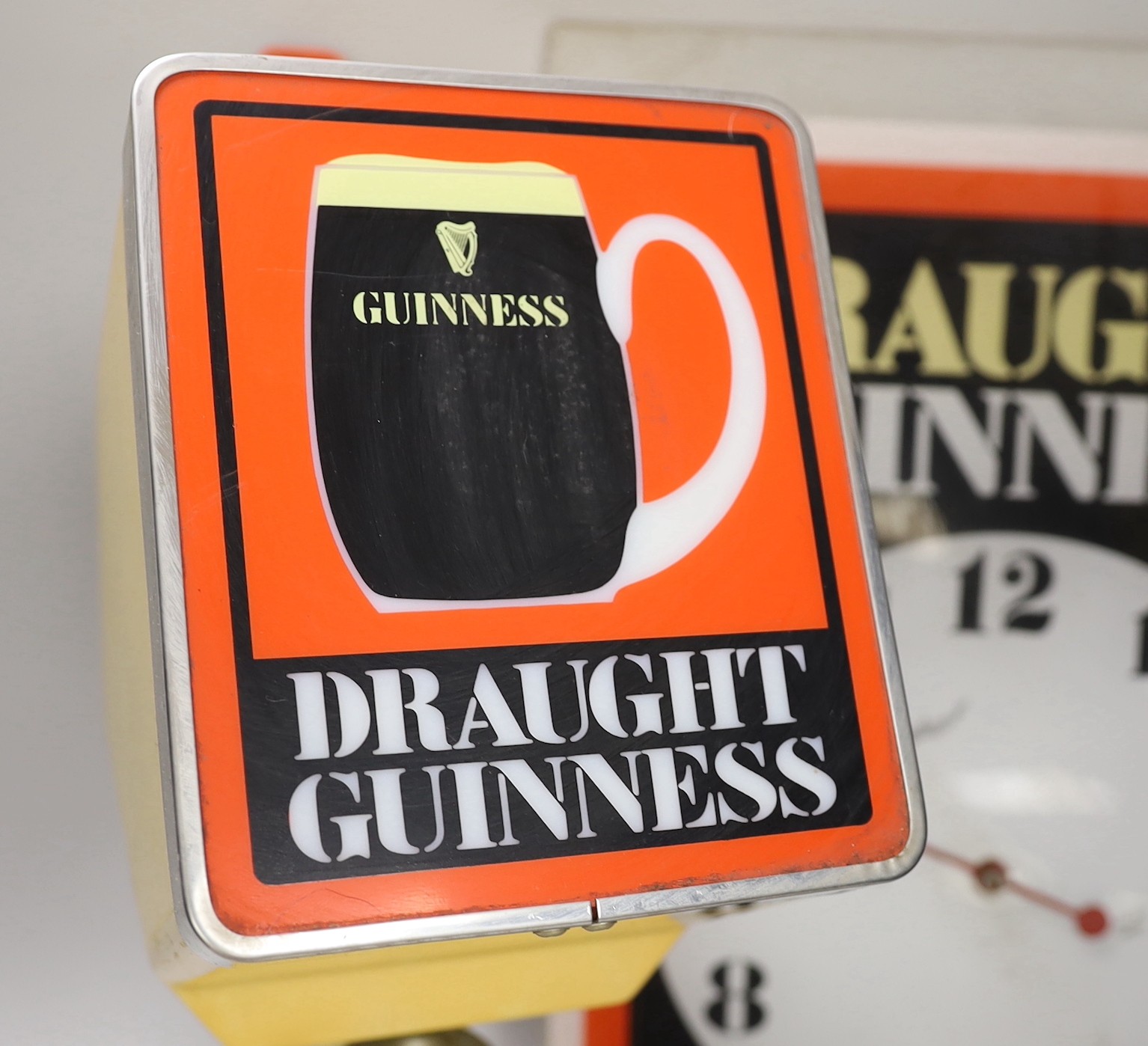 A rare Guinness bar dispenser and a Guinness wall clock